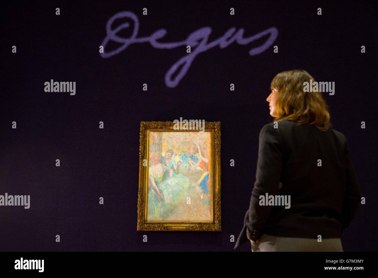 A visitor views 'Scene de ballet' by Edgar Degas, at Bonhams in London, which is expected to fetch &Acirc;&pound;2.5 million to &Acirc;&pound;3.5 million as part of Bonhams' Impressionist &amp; Modern Art auction on February 3rd. Stock Photo