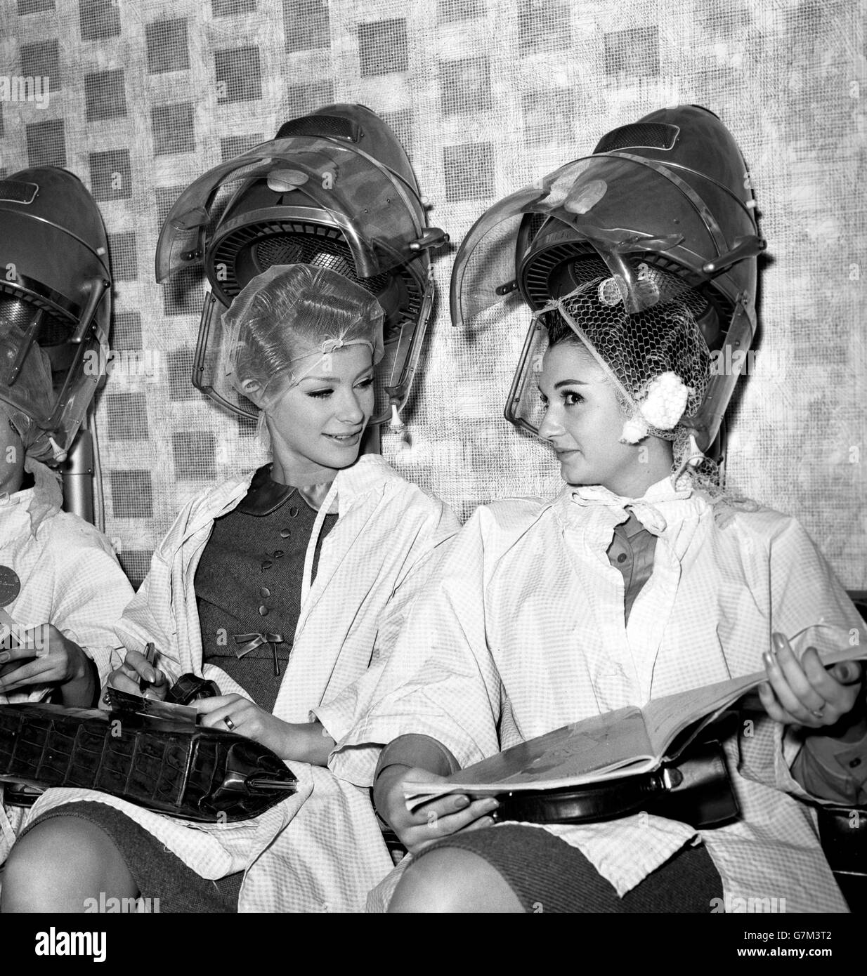 Miss Sweden Agneta Malmgren (left) and Miss Spain Maria Madronero get their hair done at the La Belle salon in Aldwych, in preparation for the Miss World contest tomorrow night at the Lyceum Ballroom. Stock Photo