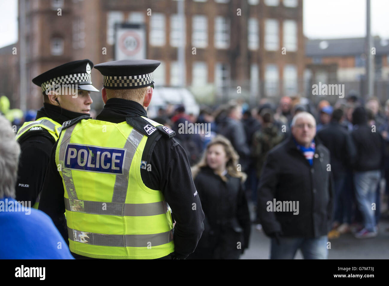 Police guard outside ground before the William Hill Scottish Cup Fifth Round match at Ibrox Stadium, Glasgow. Stock Photo