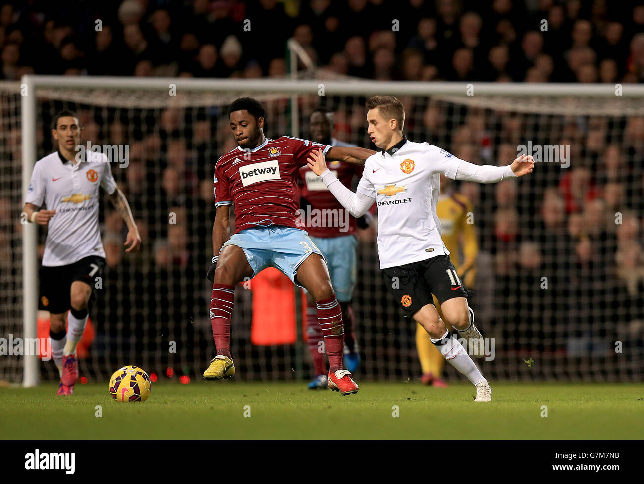 West Ham United's Alex Song battles for the ball with Manchester United's Adnan Januzaj during the Barclays Premier League match at Upton Park, London. Stock Photo