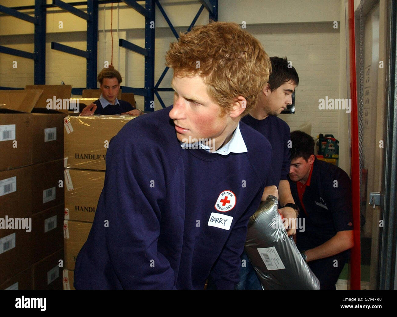Prince Harry helps with the packing of items bound for the Maldives. WPA Rota Stock Photo