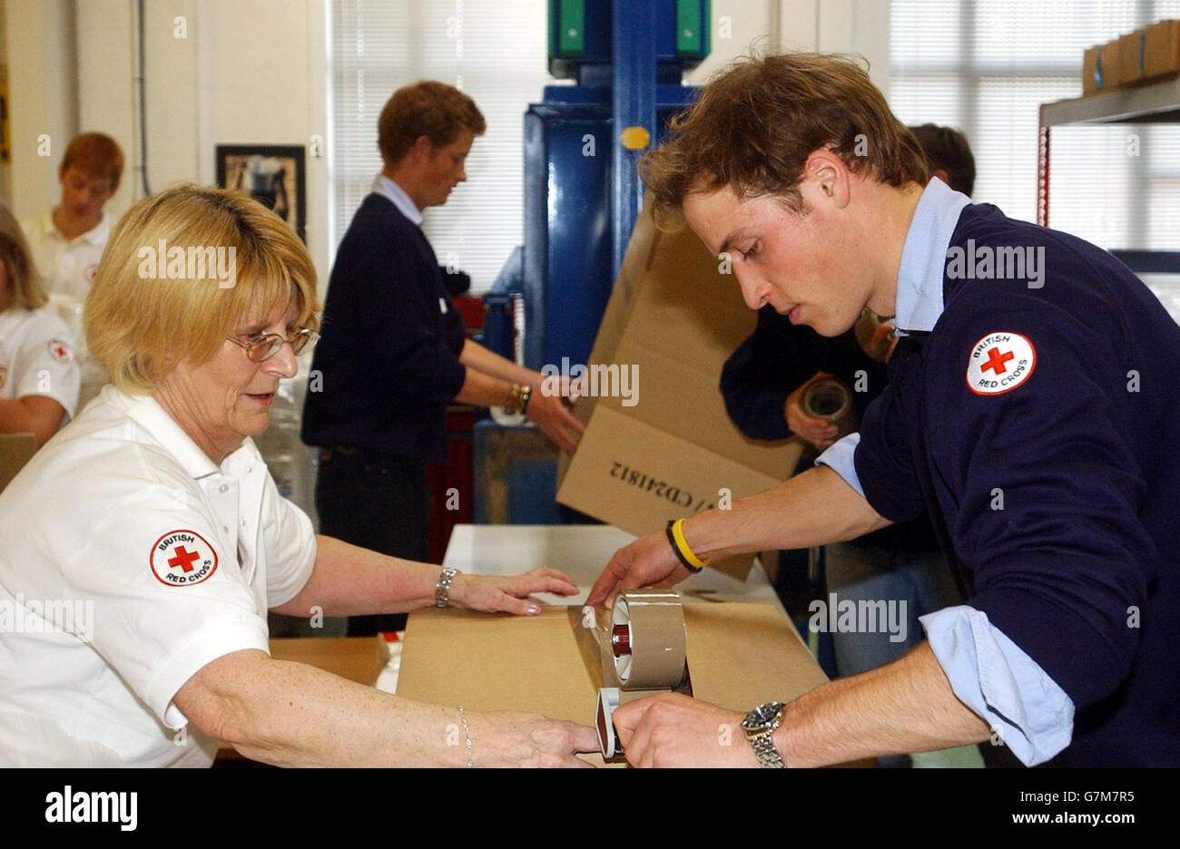 Royal Support for Relief Efforts - Red Cross Depot. Prince William helps Joyce Middleton with the packing of items bound for the Maldives. WPA Rota Stock Photo