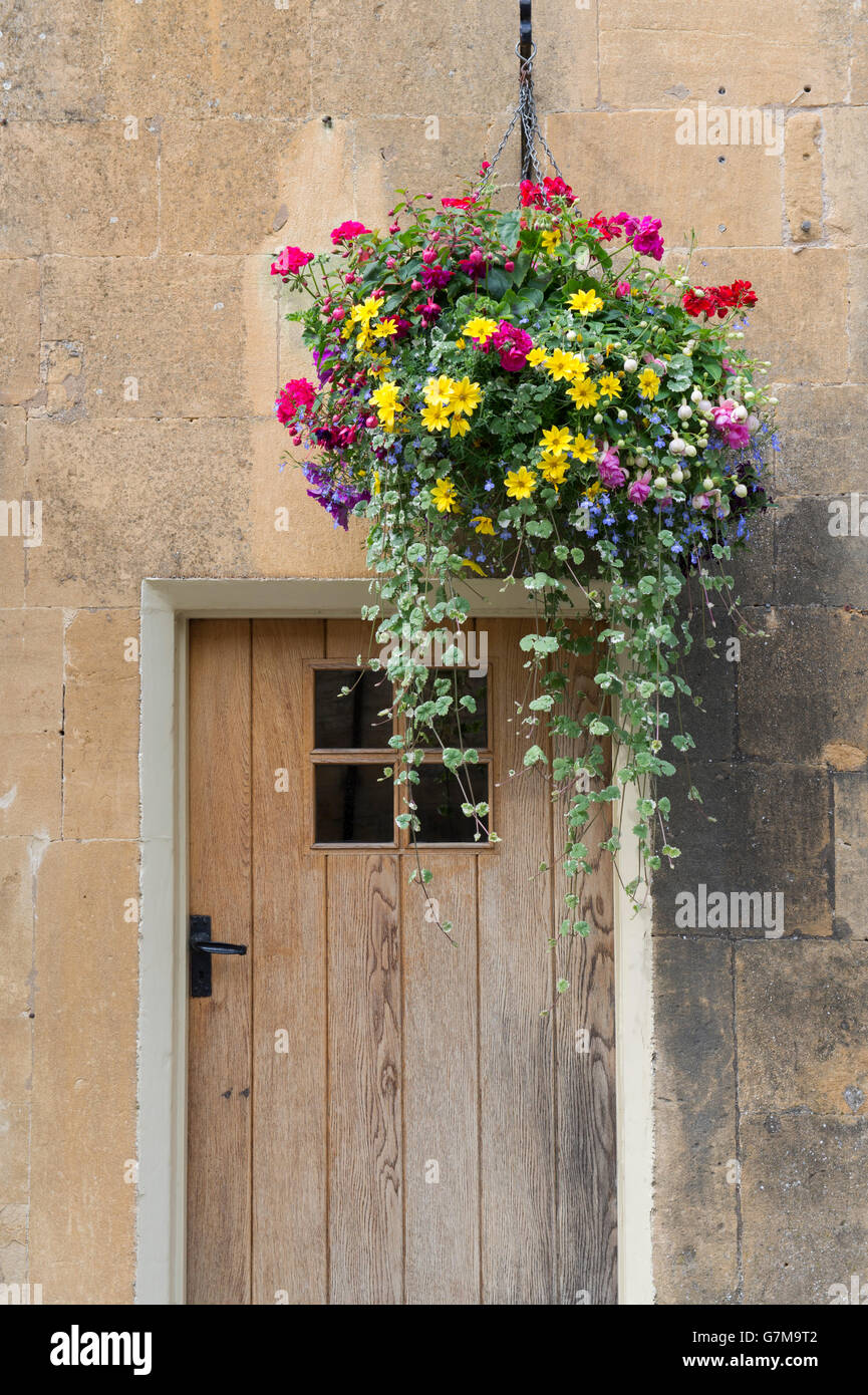 Hanging baskets on the front of the eight bells pub. Chipping Campden, Gloucestershire, England Stock Photo