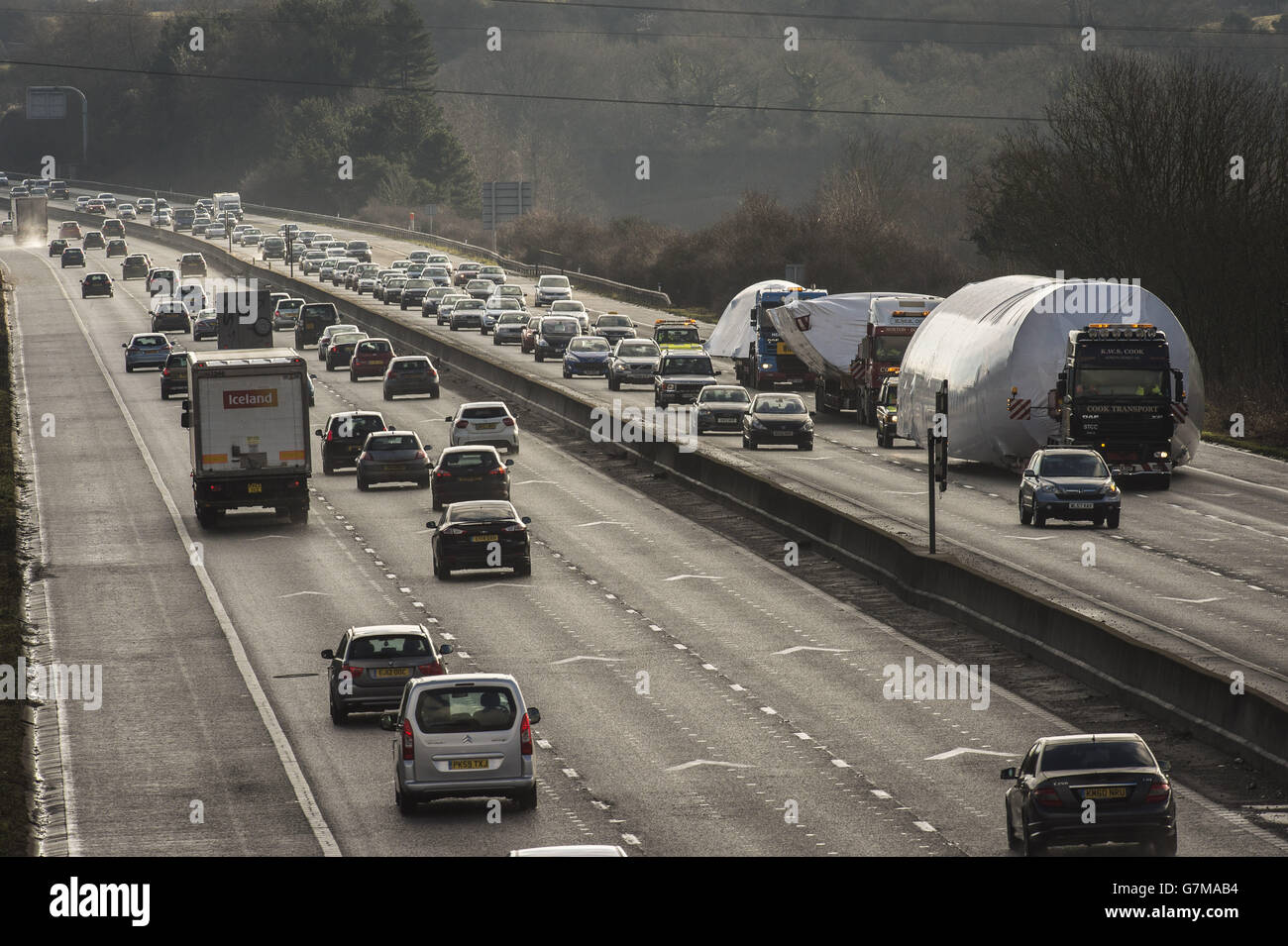 Boeing 747 fuselages hold up traffic on the M4 motorway near Bristol, as they are transported to a scrap yard in Herefordshire from Kemble airfield in Gloucestershire. Stock Photo