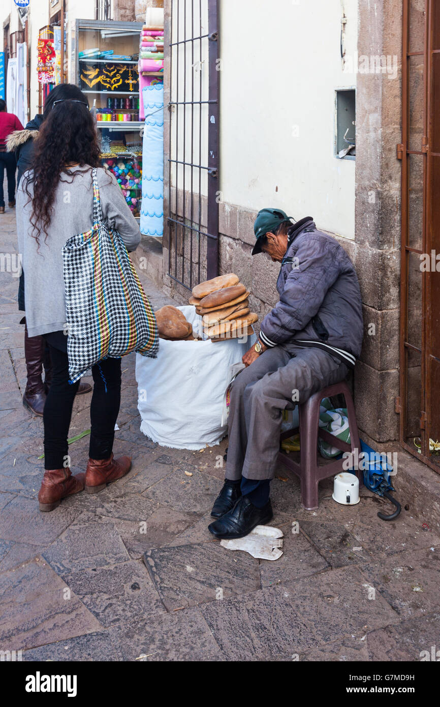 Bread vendor at the San Pedro market in Cusco, Peru Stock Photo