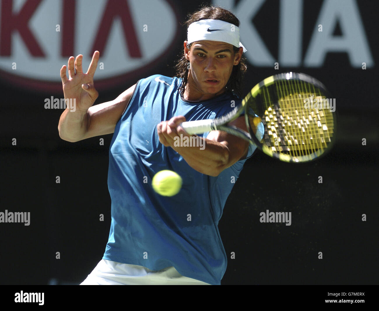 Spain's Rafael Nadal plays a powerful forehand back to Australia's Lleyton Hewitt Stock Photo