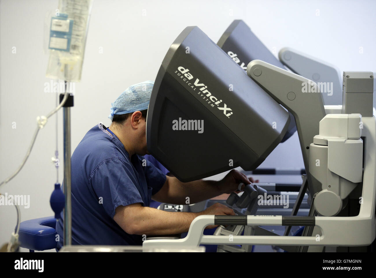 Surgeons using the da Vinci Xi surgical system carry out a colorectal surgery at the Royal Marsden in London. The leading cancer hospital became the first hospital in England to get the newest model of the surgical system which is used in the pioneering treatment of cancer patients. Stock Photo