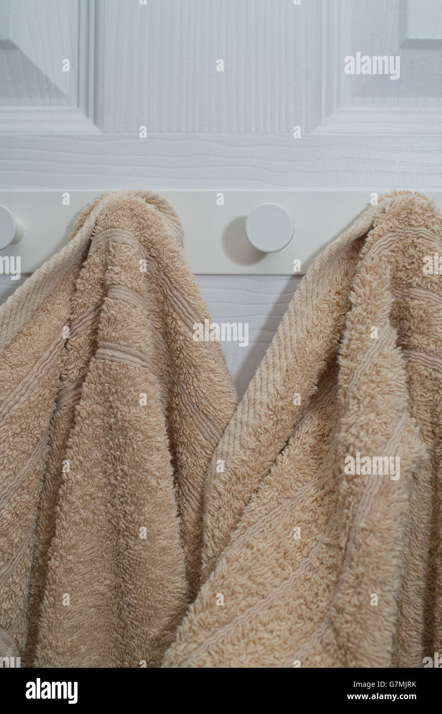 Towels hanging on hooks Stock Photo Alamy