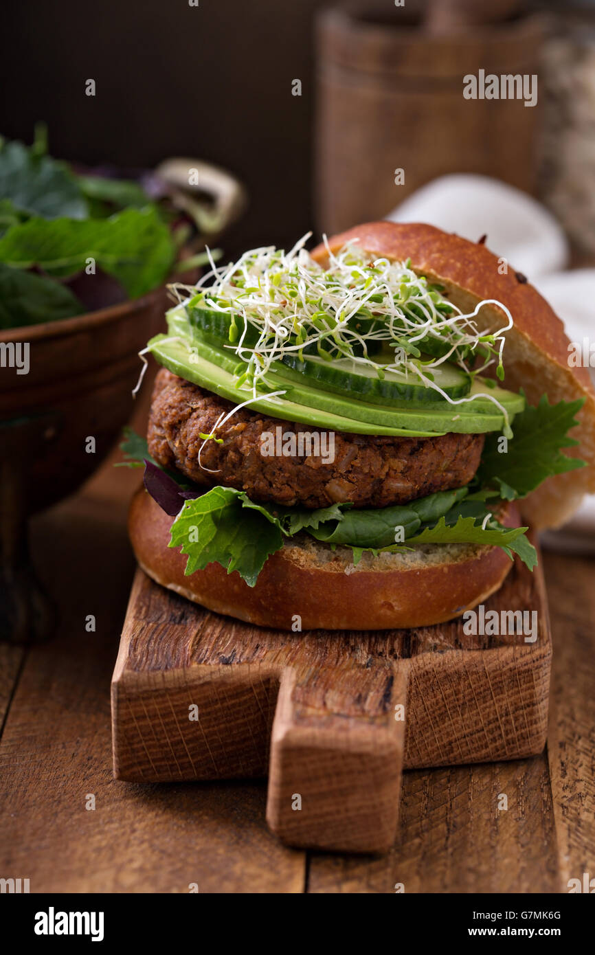 Grilled vegan bean burger with greens Stock Photo