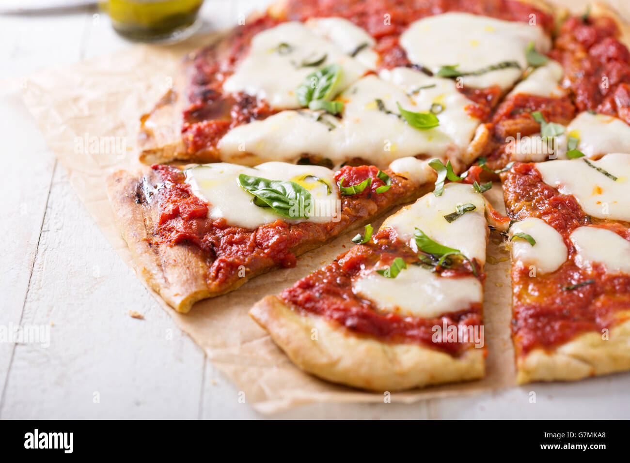 Grilled Margherita pizza with tomato sauce and mozzarella Stock Photo