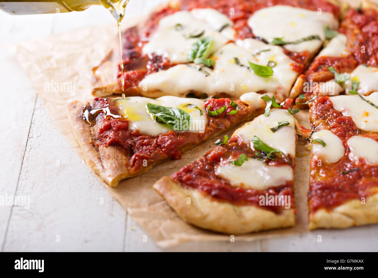 Grilled Margherita pizza with tomato sauce and mozzarella Stock Photo