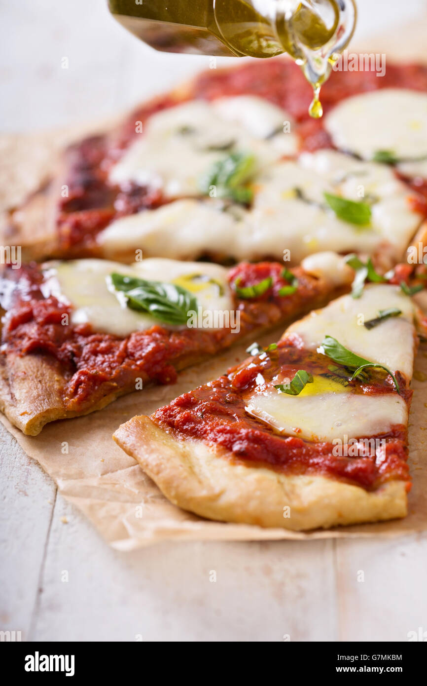 Grilled Margherita pizza with tomato sauce and mozzarella Stock Photo