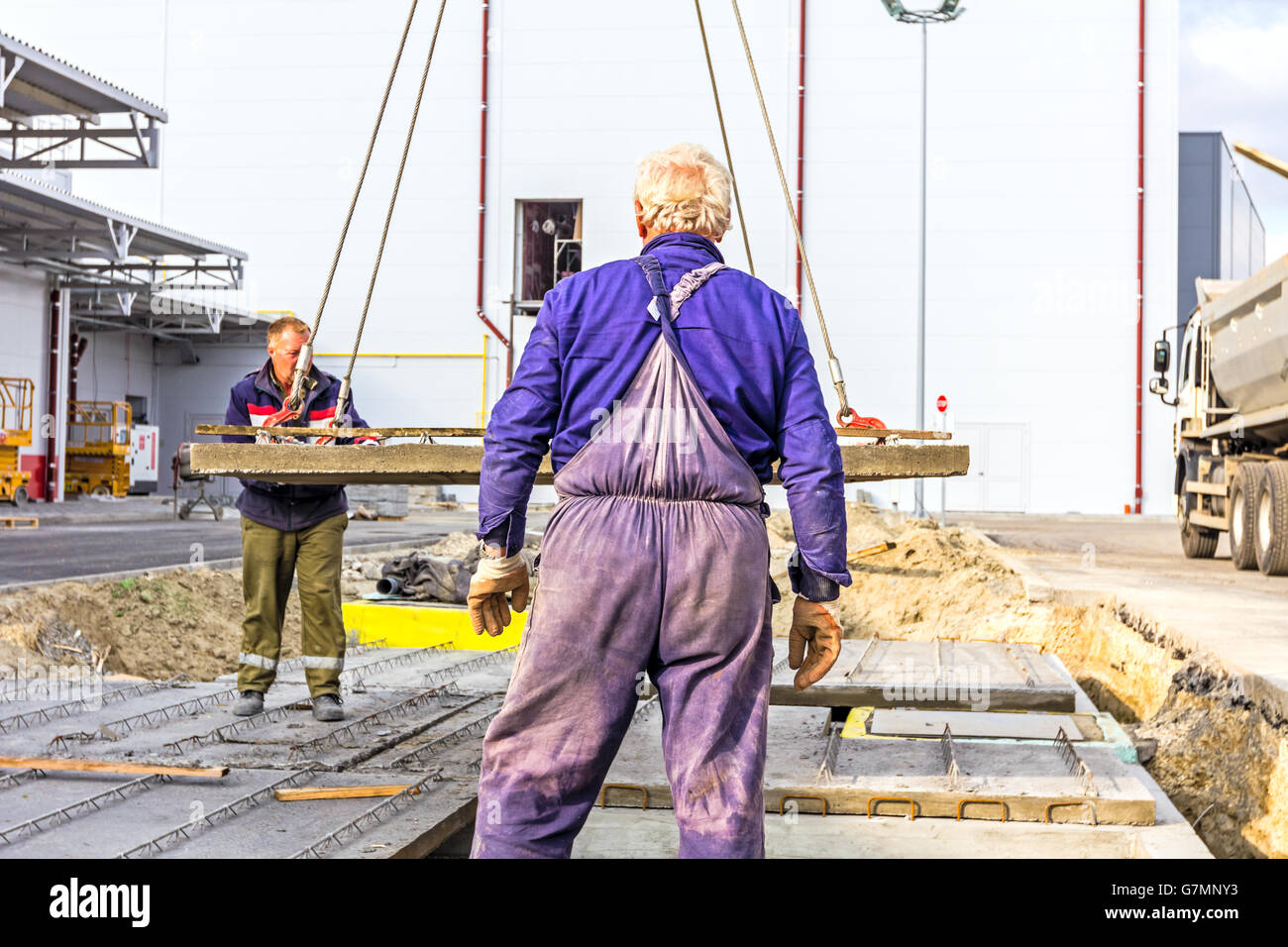 Workers are set up concrete slab to assembly underground edifice Stock ...