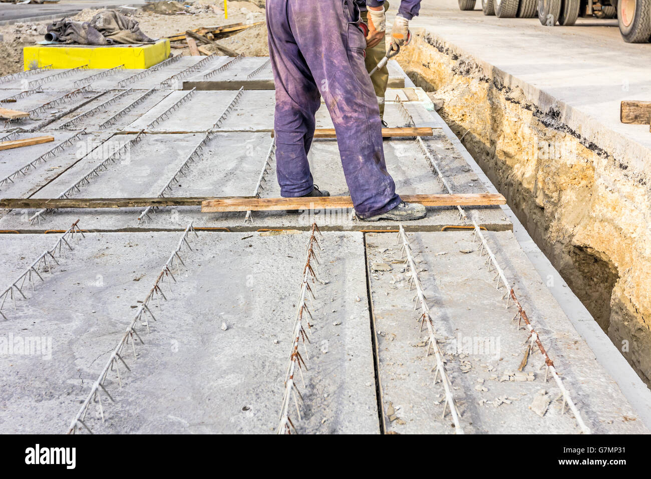 Workers are set up concrete slab to assembly underground edifice Stock ...