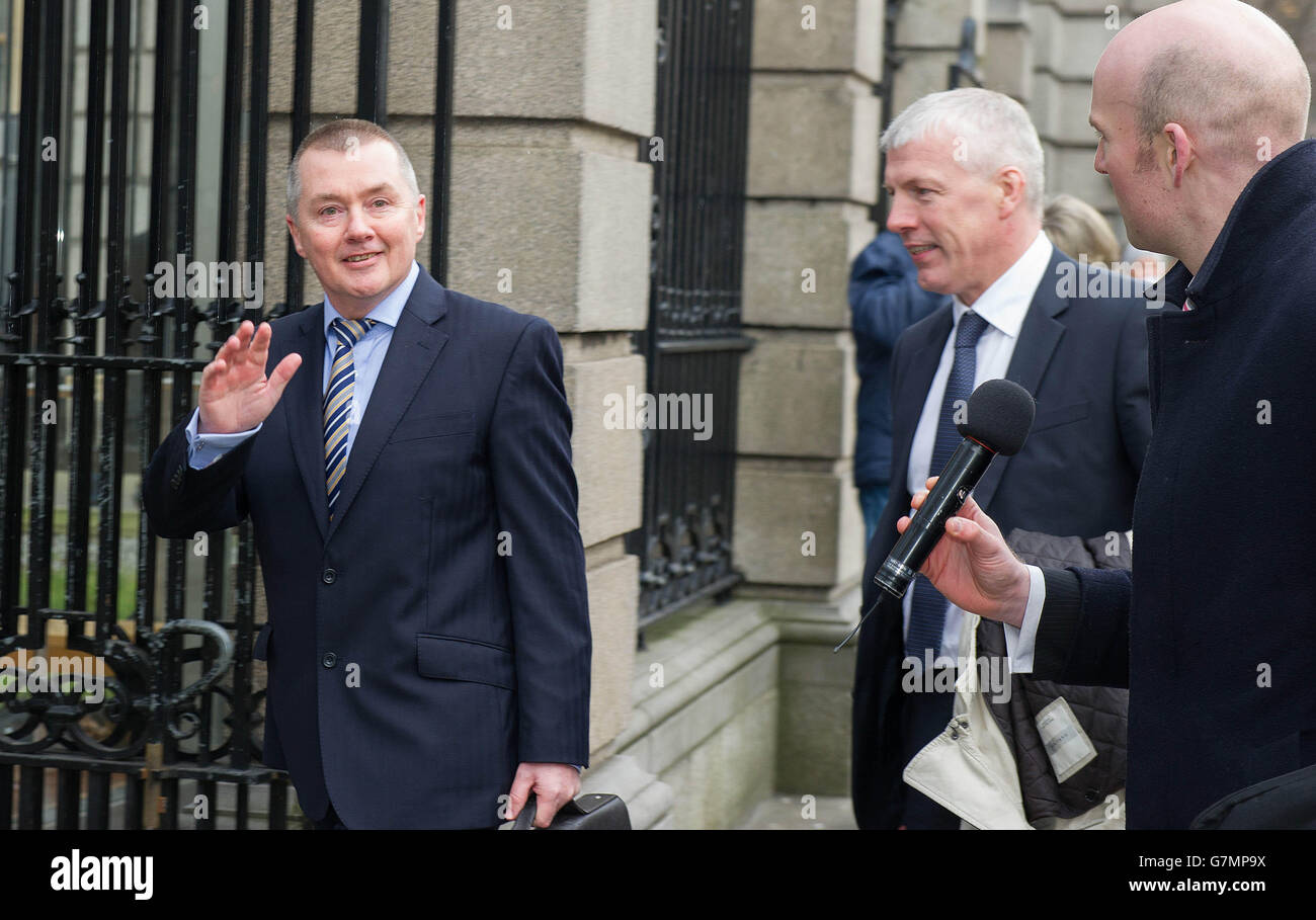 Chief executive of BA parent the International Airlines Group (IAG) Willie Walsh (left) arrives with Finbarr Griffin of Goodbody Corporate Finance (centre) at Government Buildings in Dublin, where Mr Walsh faced questions at the Oireachtas Committee on Transport on the controversial bid for airline Aer Lingus. Stock Photo