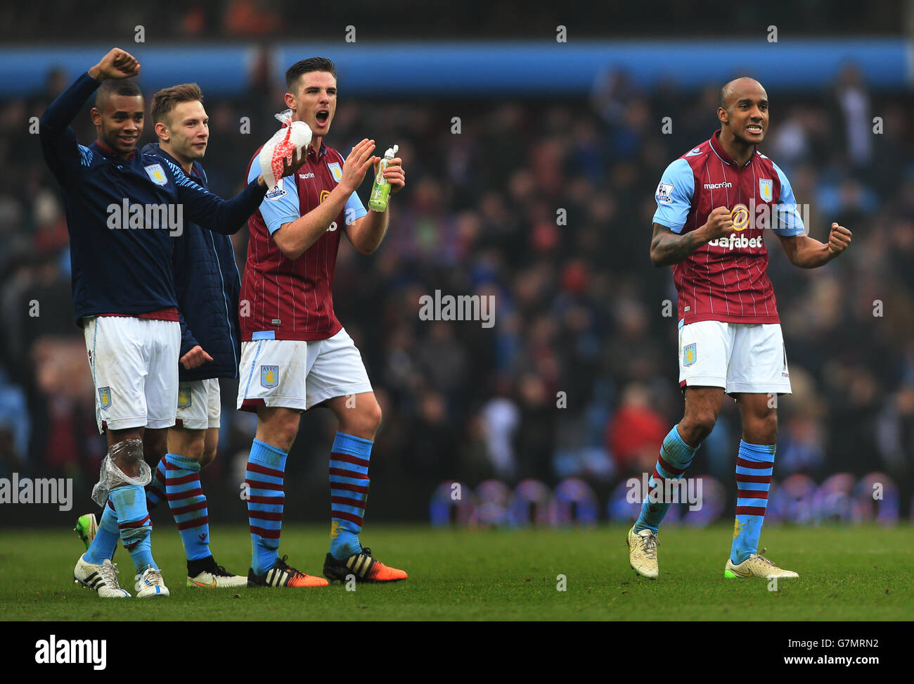 Aston Villa's Fabian Delph celebrates 2.1 win over Leicester City in FA Cup with Holte End fans teammates Leandro Bacuna (left), Andreas Weimann and Ciaran Clark Stock Photo