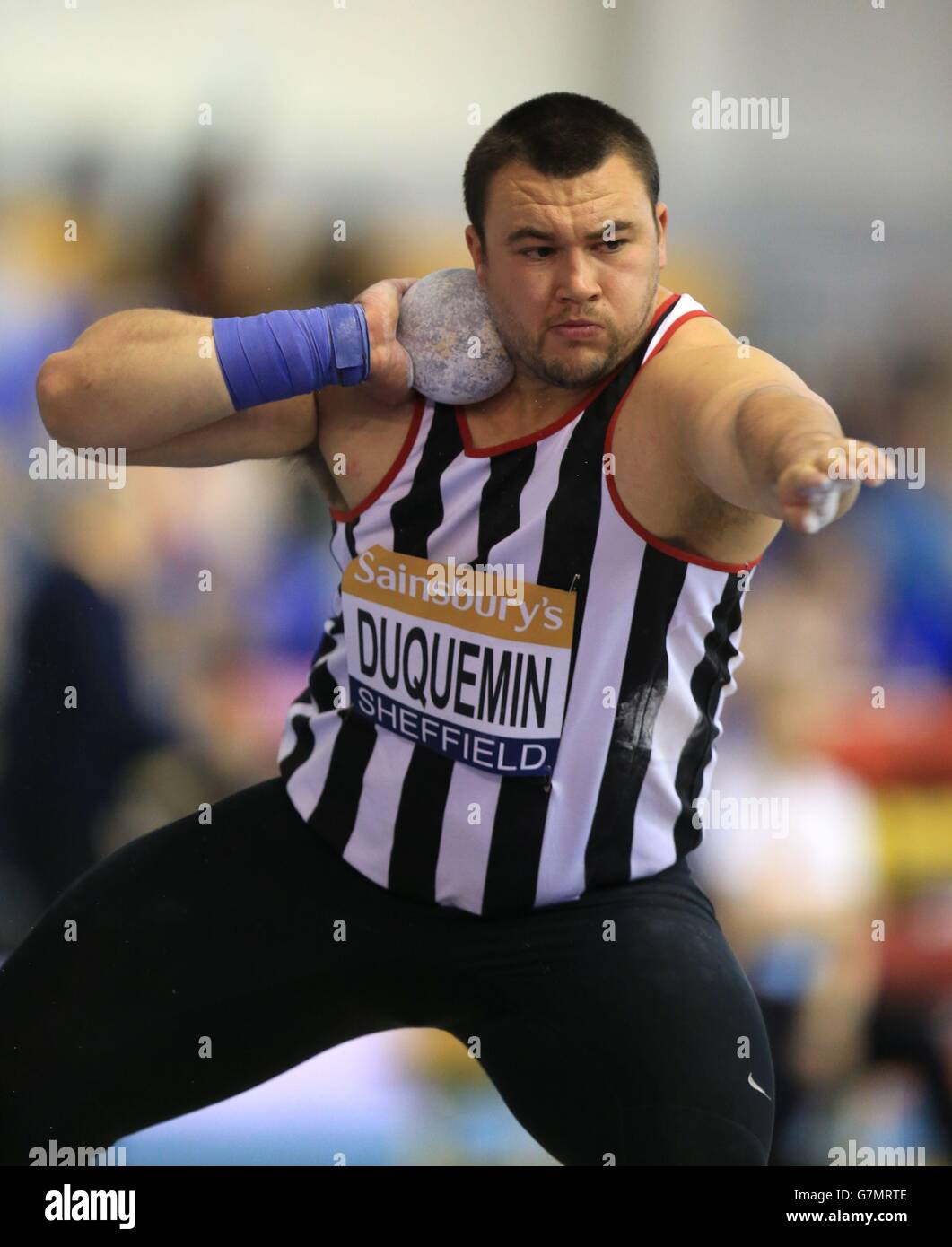 Zane Duquemin on his way to winning the mens shot putt final during day two of the Sainsbury's British Indoor Championships at the English Institute of Sport, Sheffield. Stock Photo