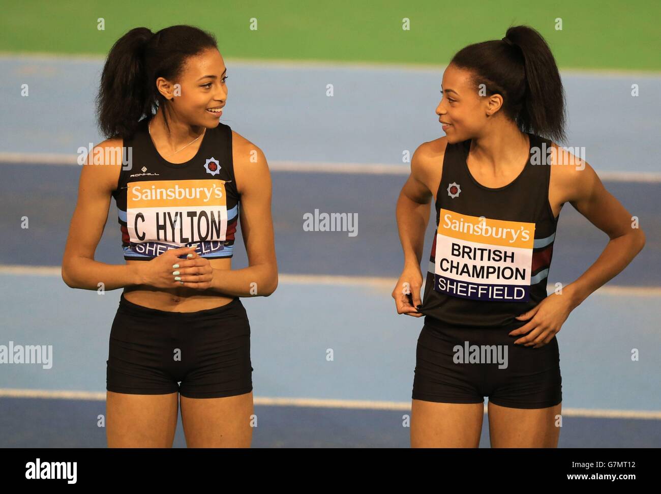 Shannon Hylton (right) and her twin sister Cheriece Hylton after finishing first and second in the women's 200m final during day two of the Sainsbury's British Indoor Championships at the English Institute of Sport, Sheffield. Stock Photo