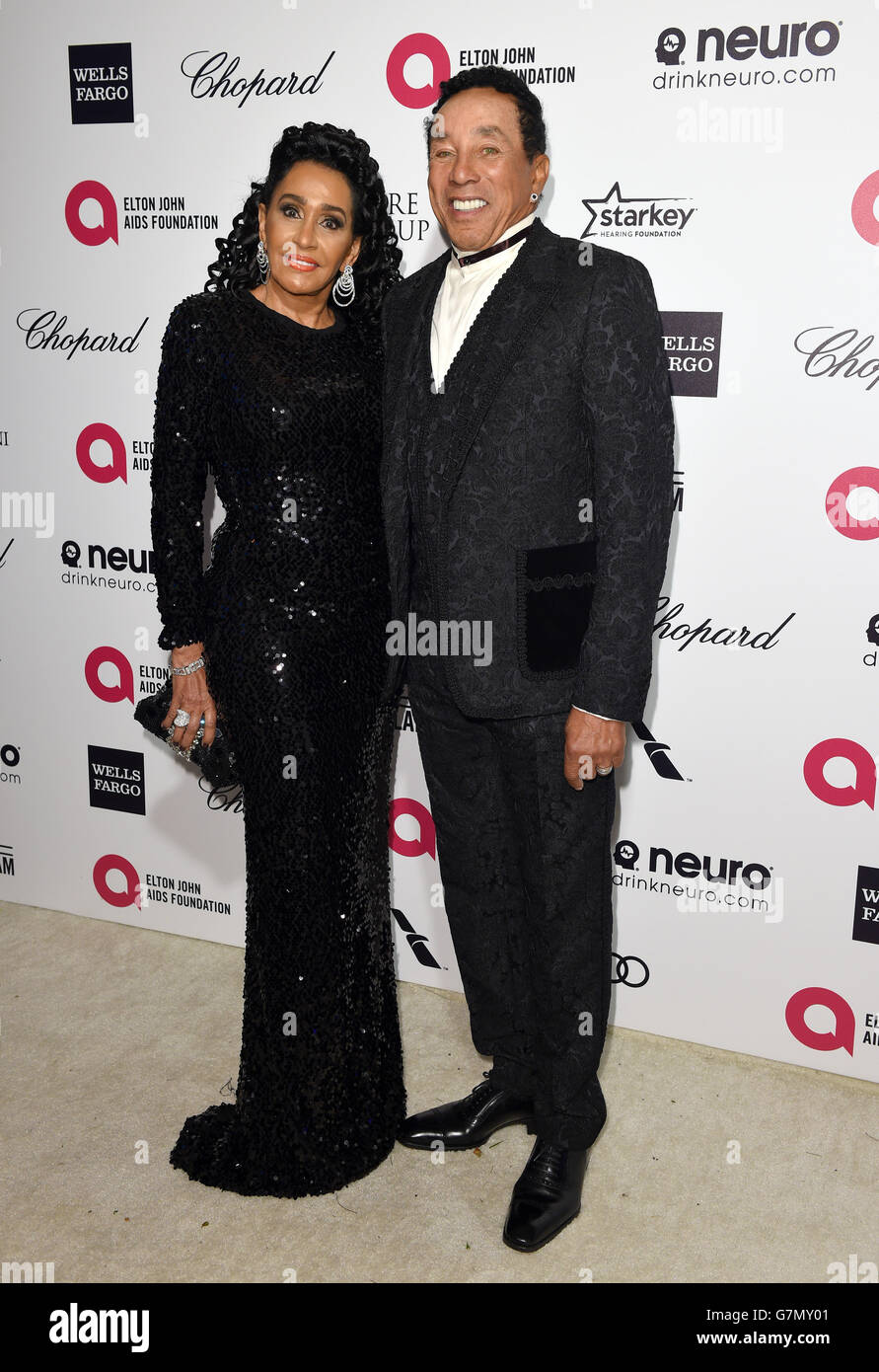 Frances Glandney and Smokey Robinson arrive for the Elton John AIDS Foundation's 23rd annual Academy Awards Viewing Party at West Hollywood Park in Los Angeles. Stock Photo