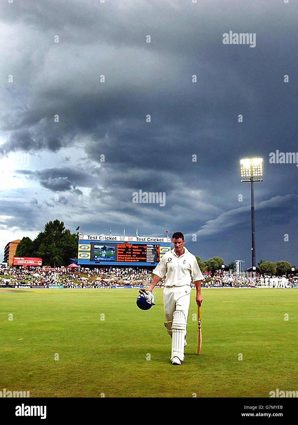 England's Andrew Strauss leaves the field after being caught by South Africa's Mark Boucher off the bowling of Andre Nel for 44 runs. Stock Photo