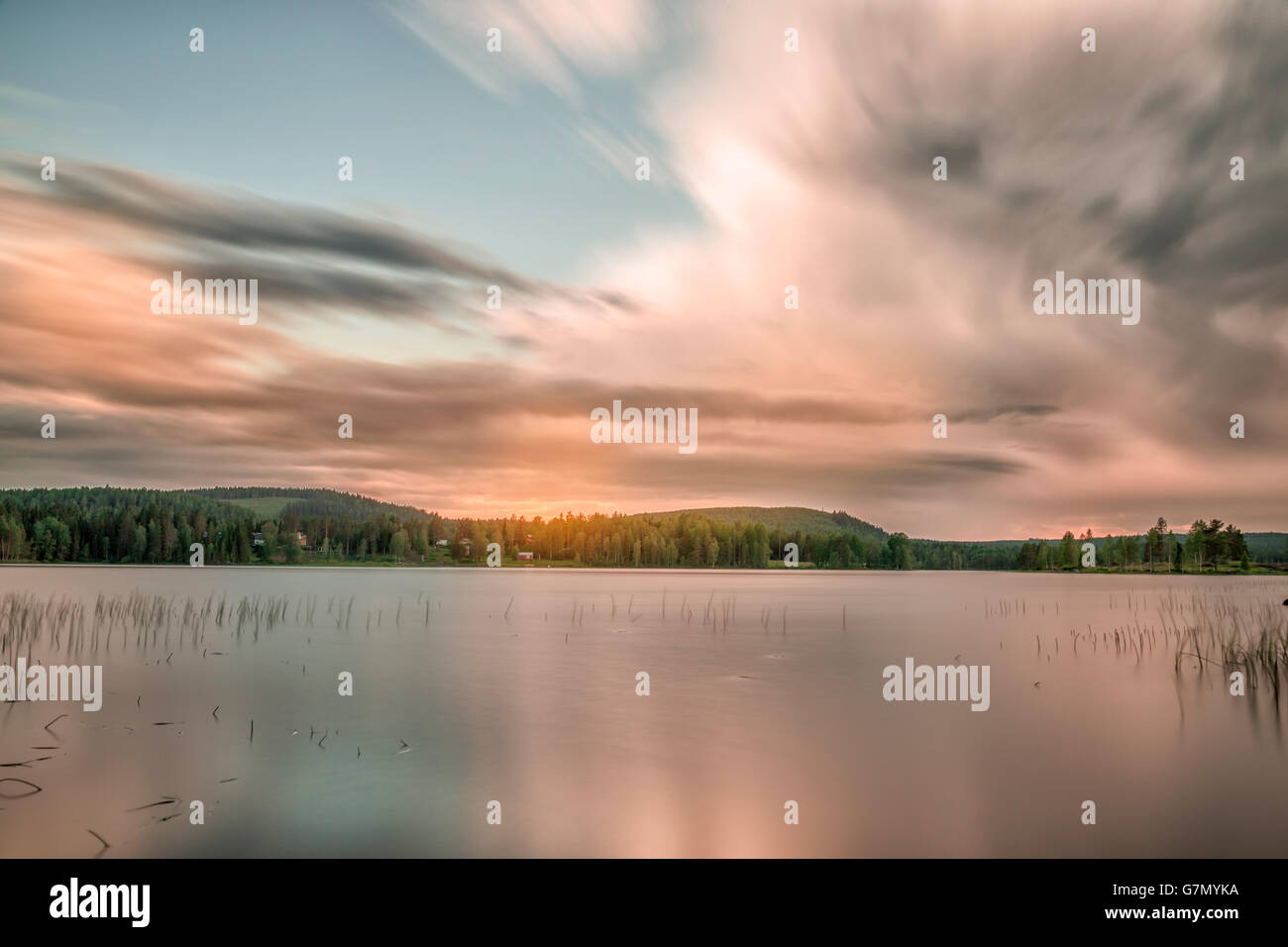 Lake with Forest and a cloudy sky Stock Photo - Alamy