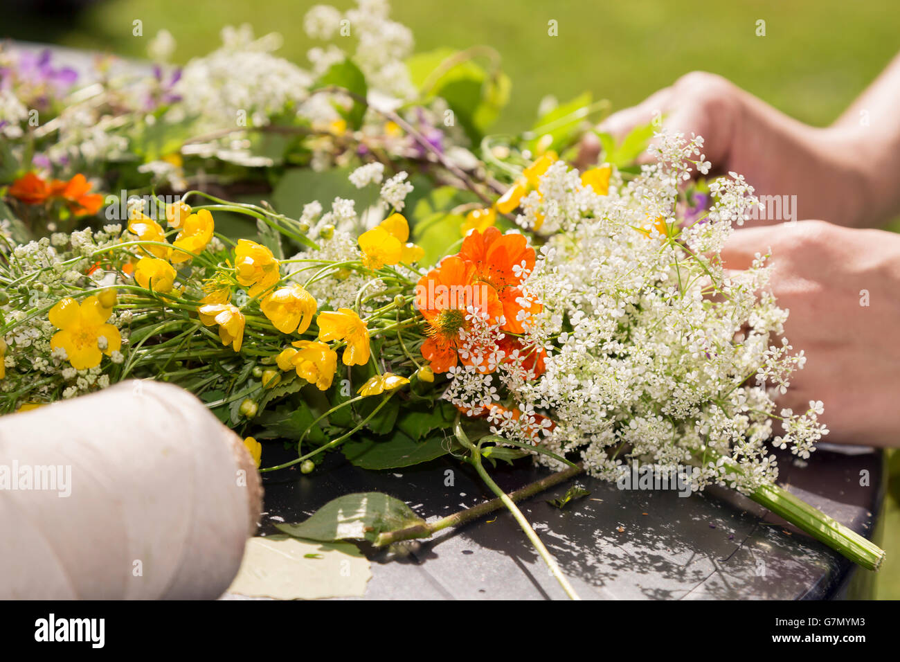 Woman Making a Swedish Midsummer Head Creation. Stock Photo
