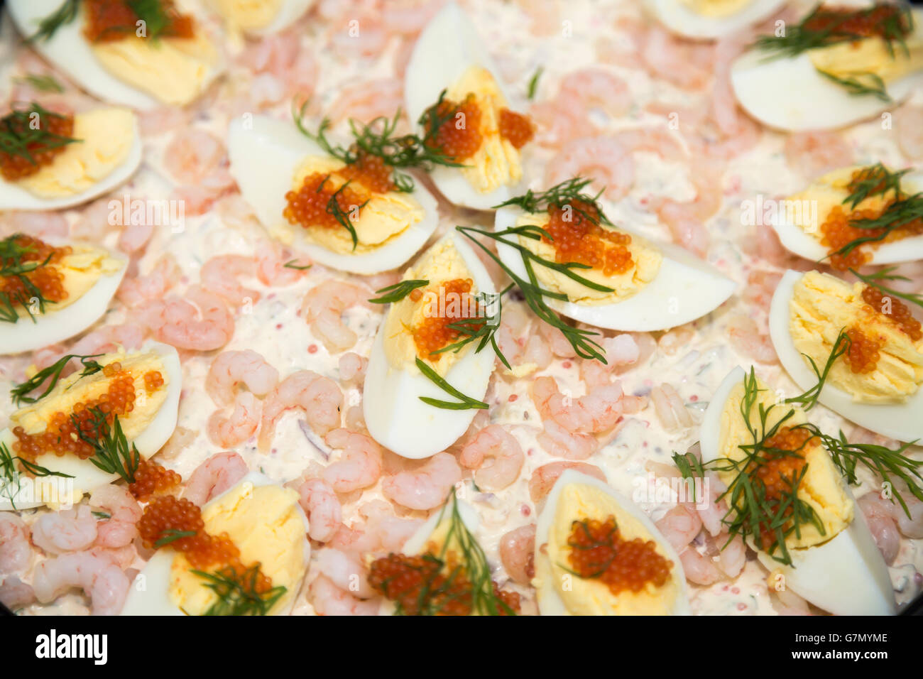 Cake with Eggs, Shrimp and Bleak Roe close up. Stock Photo