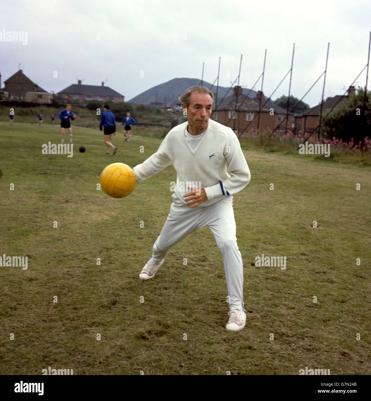 Port Vale's new general manager Sir Stanley Matthews works his team's goalkeepers during a training session on the local Co-operative Society's ground Stock Photo
