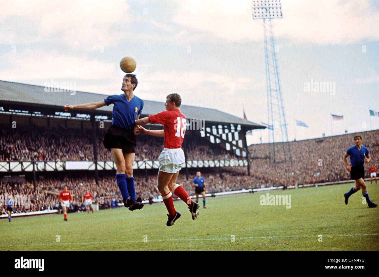 Soccer - World Cup England 1966 - Group Four - Italy v USSR. Italy's Giacinto Facchetti (l) heads clear from USSR's Anatoly Banishevski (r) Stock Photo
