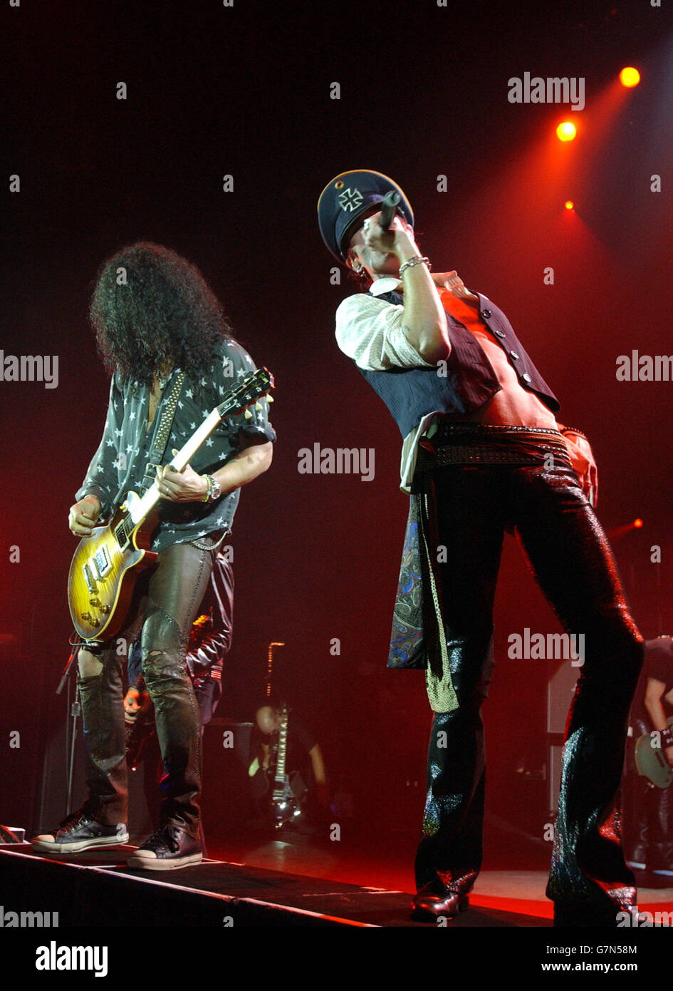 Scott Weiland (right) and Slash perform live on stage. Stock Photo