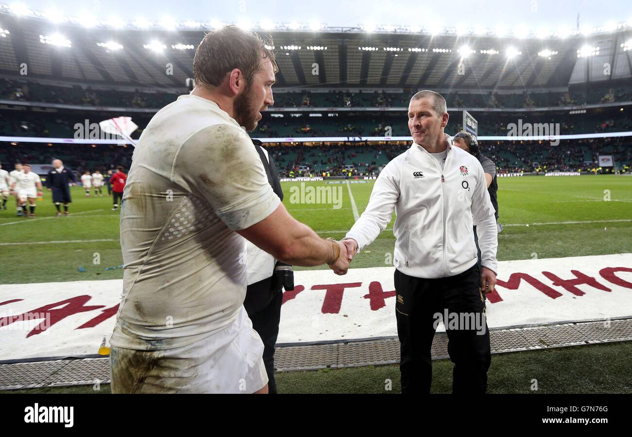 England coach Stuart Lancaster congratulates his captain Chris Robshaw after victory over Italy in the 6 Nations match at Twickenham, London. Stock Photo