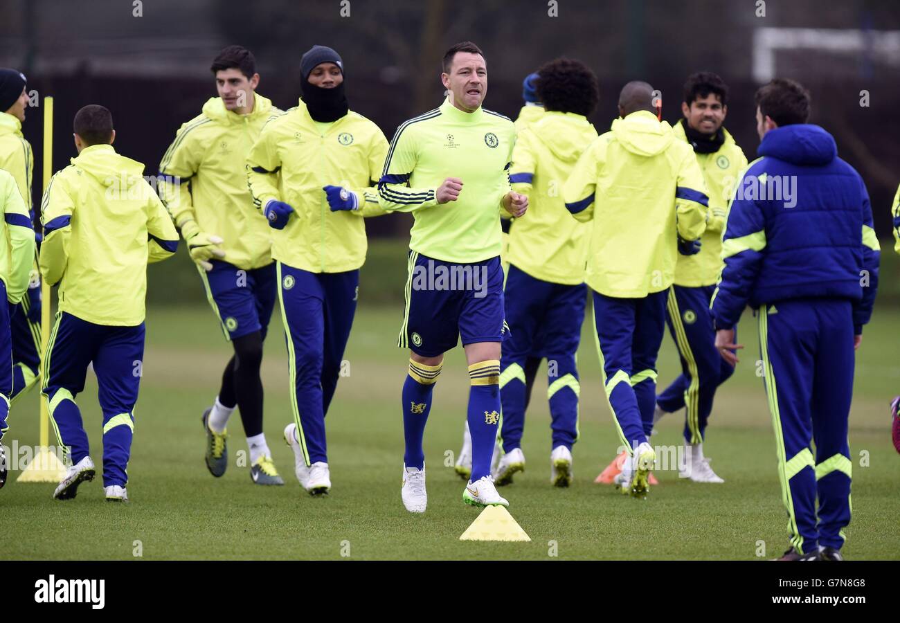 Chelsea's John Terry (right), Didier Drogba (centre) goalkeeper Thibaut Courtois (left) during a training session at Cobham Training Ground, Cobham. Stock Photo