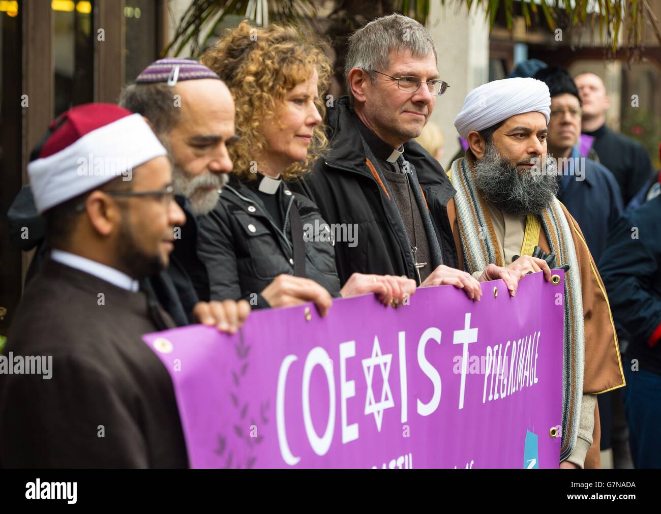 (left to right) Imam Sheikh Khalifa Ezzat, Rabbi Jonathan Wittenberg, Rev. Margaret Cave, Dean of Coventry John Witcombe and Assistant Secretary General of the Muslim Association of Great Britain Ibrahim Mogra at the start of the Coexist march at the London Central Mosque in Regent's Park, London. Stock Photo