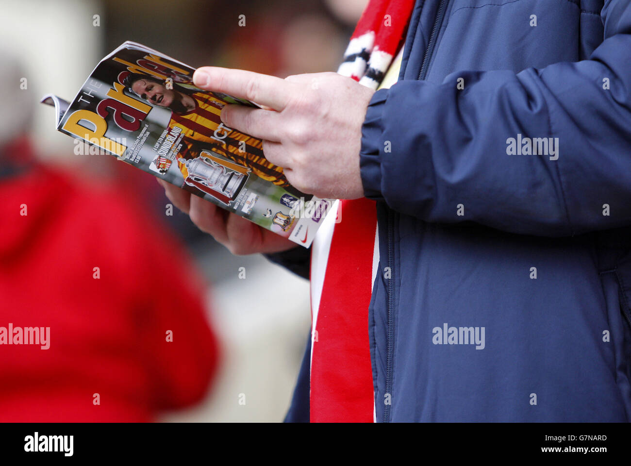 Soccer - FA Cup - Fifth Round - Bradford City v Sunderland - Valley Parade. A Bradford City fan reads the matchday program Stock Photo