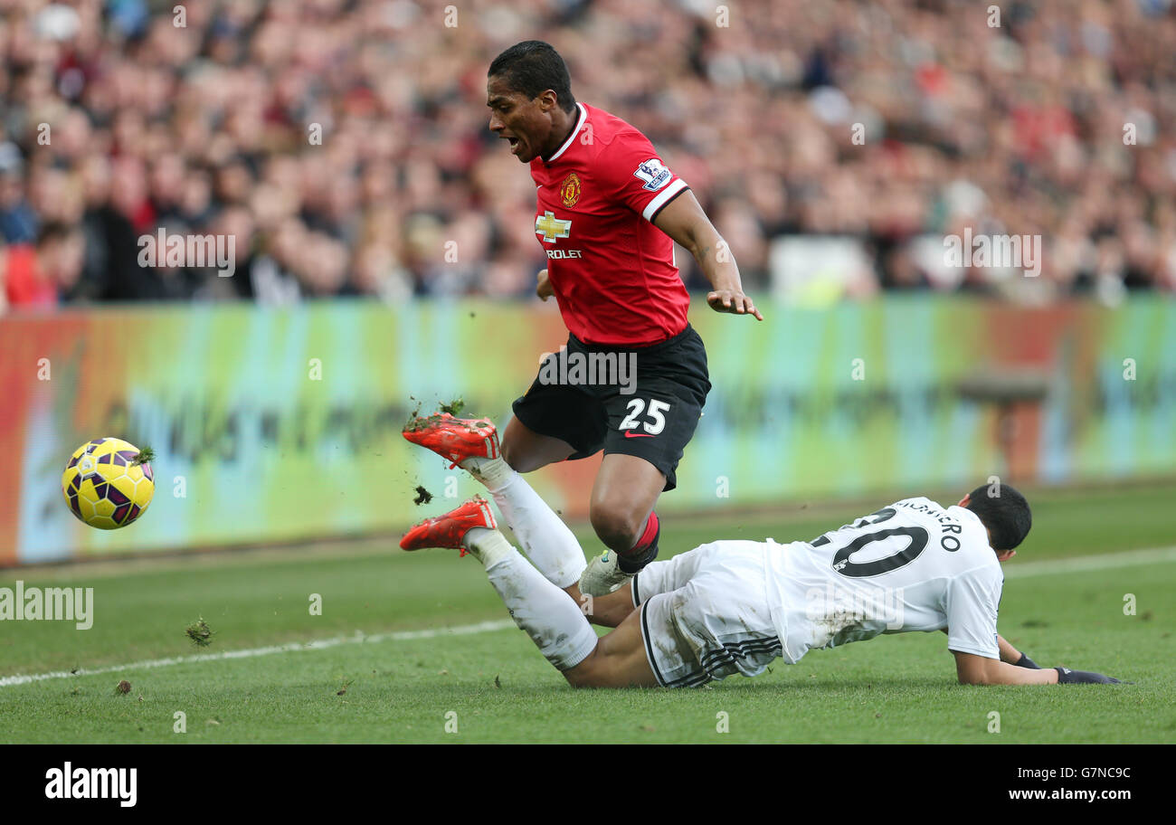 Manchester United's Antonio Valencia and Swansea City's Jefferson Montero during the Barclays Premier League match at the Liberty Stadium, Swansea. PRESS ASSOCIATION Photo. Picture date: Saturday February 21, 2015. See PA story SOCCER Swansea. Photo credit should read: David Davies/PA Wire. Stock Photo