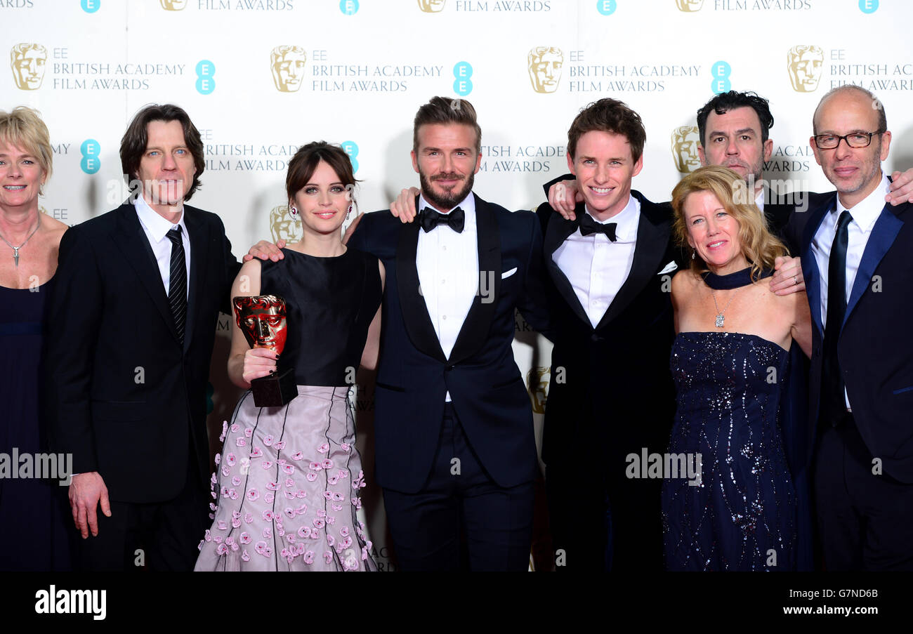 Lisa Bruce, Anthony McCarten, Steven Noble, Krystyan Mallet, James Marsh, Tim Devan, Eric Fellner, Eddie Redmayne and Felicity Jones alongside presenter David Beckham (centre) with the Outstanding British Film Award for The Theory of Everything, at the EE British Academy Film Awards at the Royal Opera House, Bow Street in London. PRESS ASSOCIATION Photo. Picture date: Sunday February 8, 2015. See PA story SHOWBIZ Bafta. Photo credit should read: Dominic Lipinski/PA Wire Stock Photo
