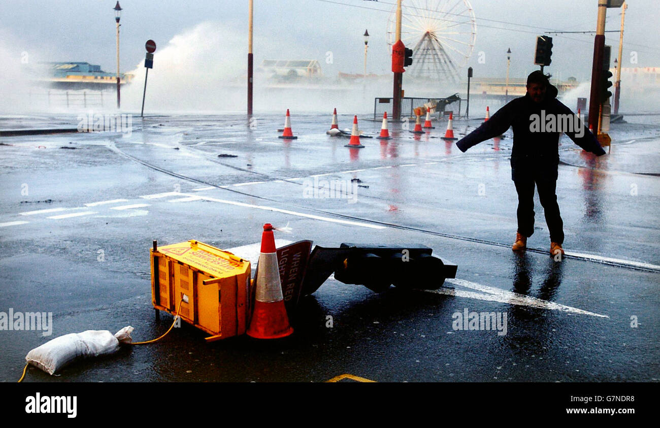 Storm force winds make the seafront at Blackpool difficult even for pedestrians. Stock Photo