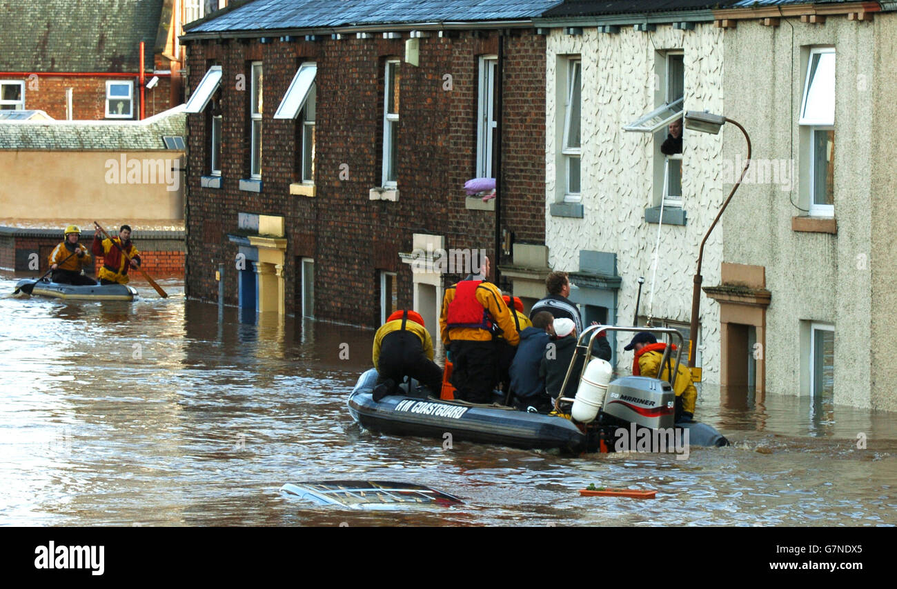 severe-flooding-in-carlisle-rescue-workers-help-residents-out-of-the