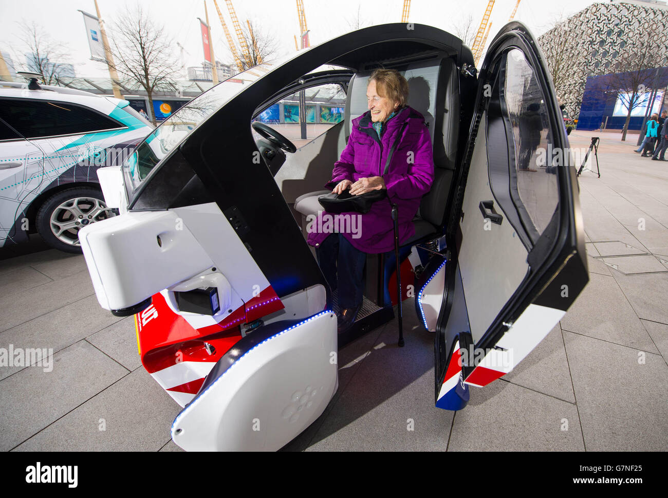 Brenda Stevenson, 82, from Greenwich sits inside a prototype of the Pathfinder driverless pod, that will be the first autonomous vehicle in the UK to work on public footpaths, which has been unveiled today by the Transport Systems Catapult at a Government launch event in Greenwich, London. Stock Photo