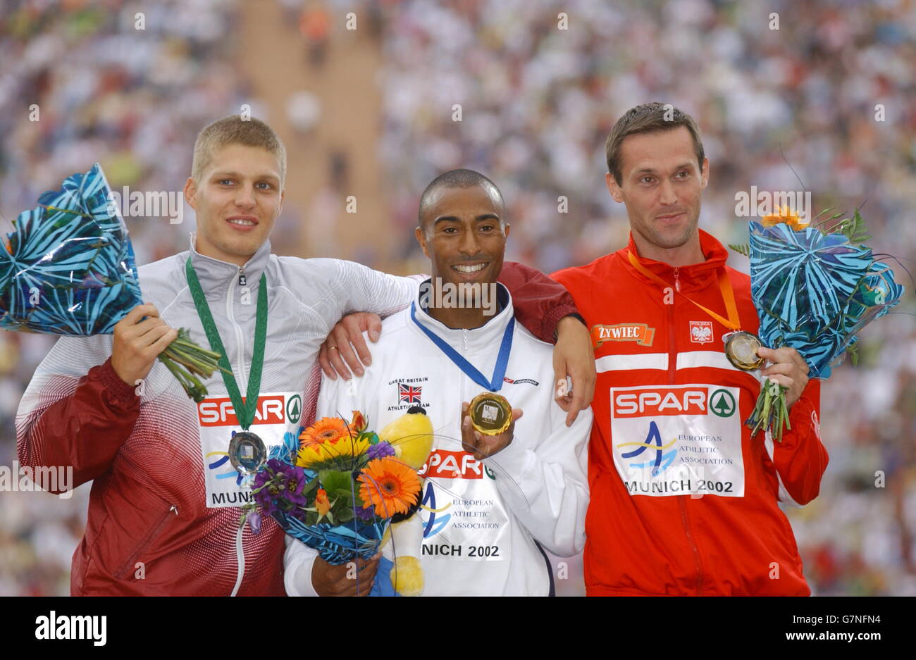 (L-R) The medallists stand atop the podium: Latvia's Stanislavs Olijars (silver), Great Britain's Colin Jackson (gold), Poland's Artur Kohutek (bronze) Stock Photo
