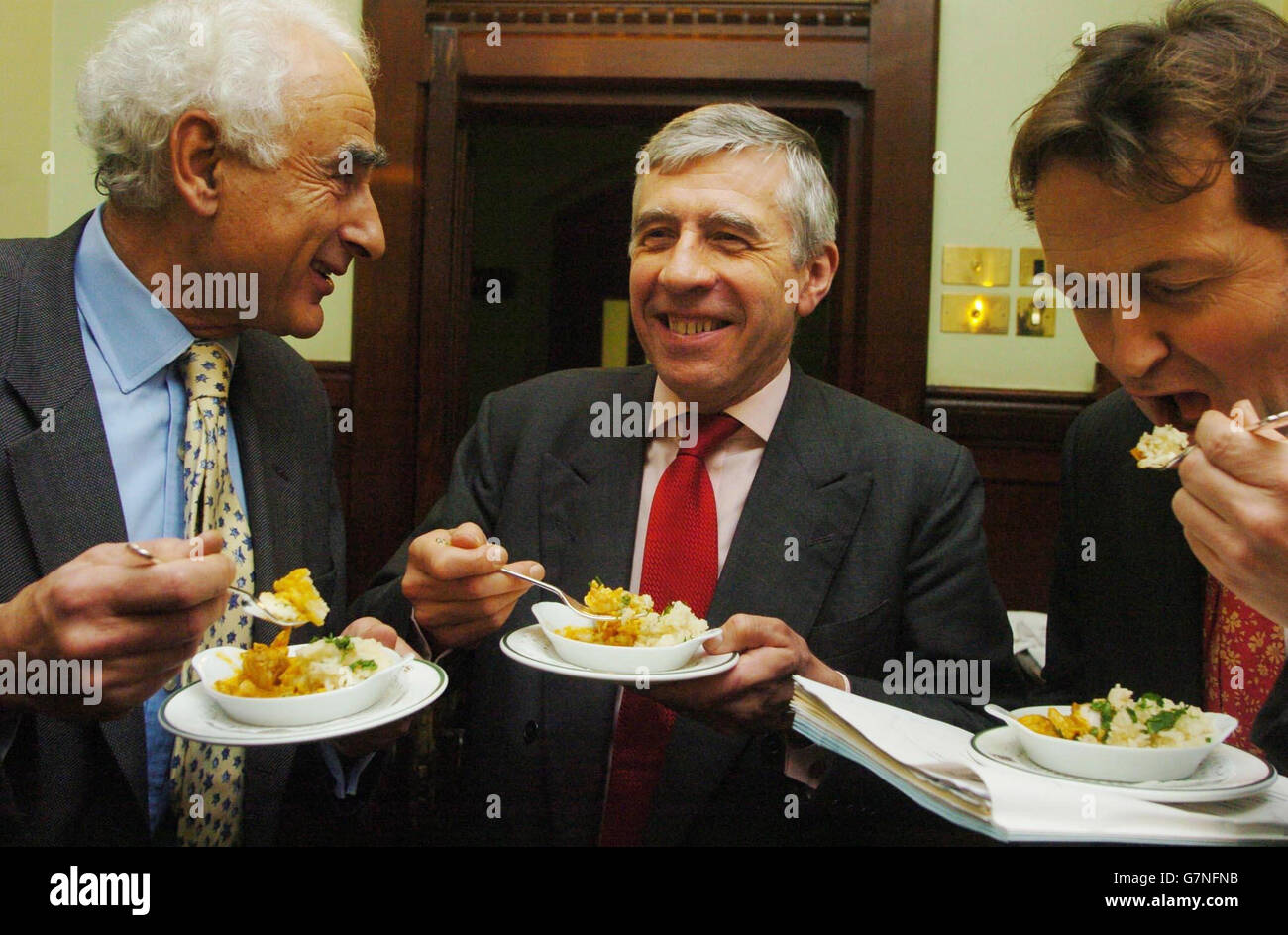 Foreign Secretary Jack Straw tries some Sri Lankan fish with rice along with Liberal Democrat Fisheries Spokesman Andrew George (right) and Anthony Steen's (left) at the launch of 'Fish and Ships'. Stock Photo