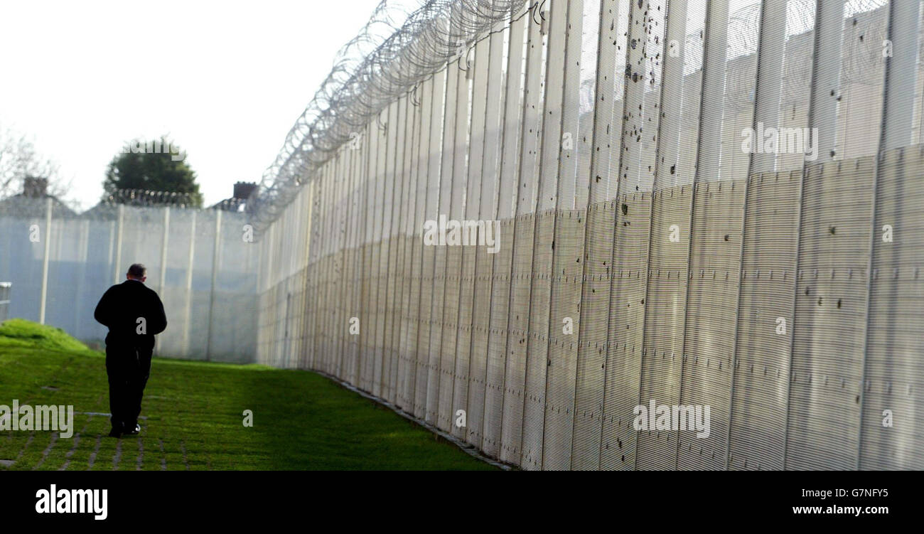 Cheif Inspector of Prisons Report - HM Prison Chelmsford. A guard patrols the boundary. Stock Photo