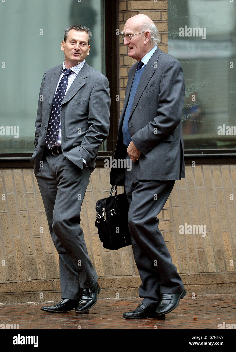 Julian Benstead and Edward James (right) outside Southwark Crown Court in south London, where they will stand trial in the Crown Currency Exchange fraud trial, later this week. Stock Photo