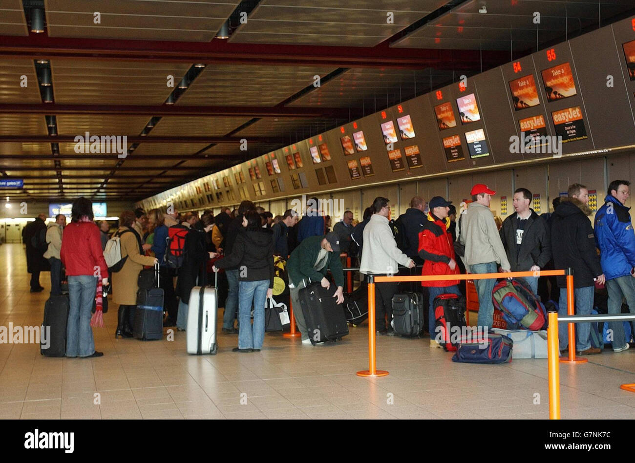 Passengers in the check-in area. Low-fare airline Ryanair celebrated the start of services from Luton to Esjberg in Denmark, Stockholm, Pisa, Venice Treviso, Girona, and Nimes in France. Stock Photo