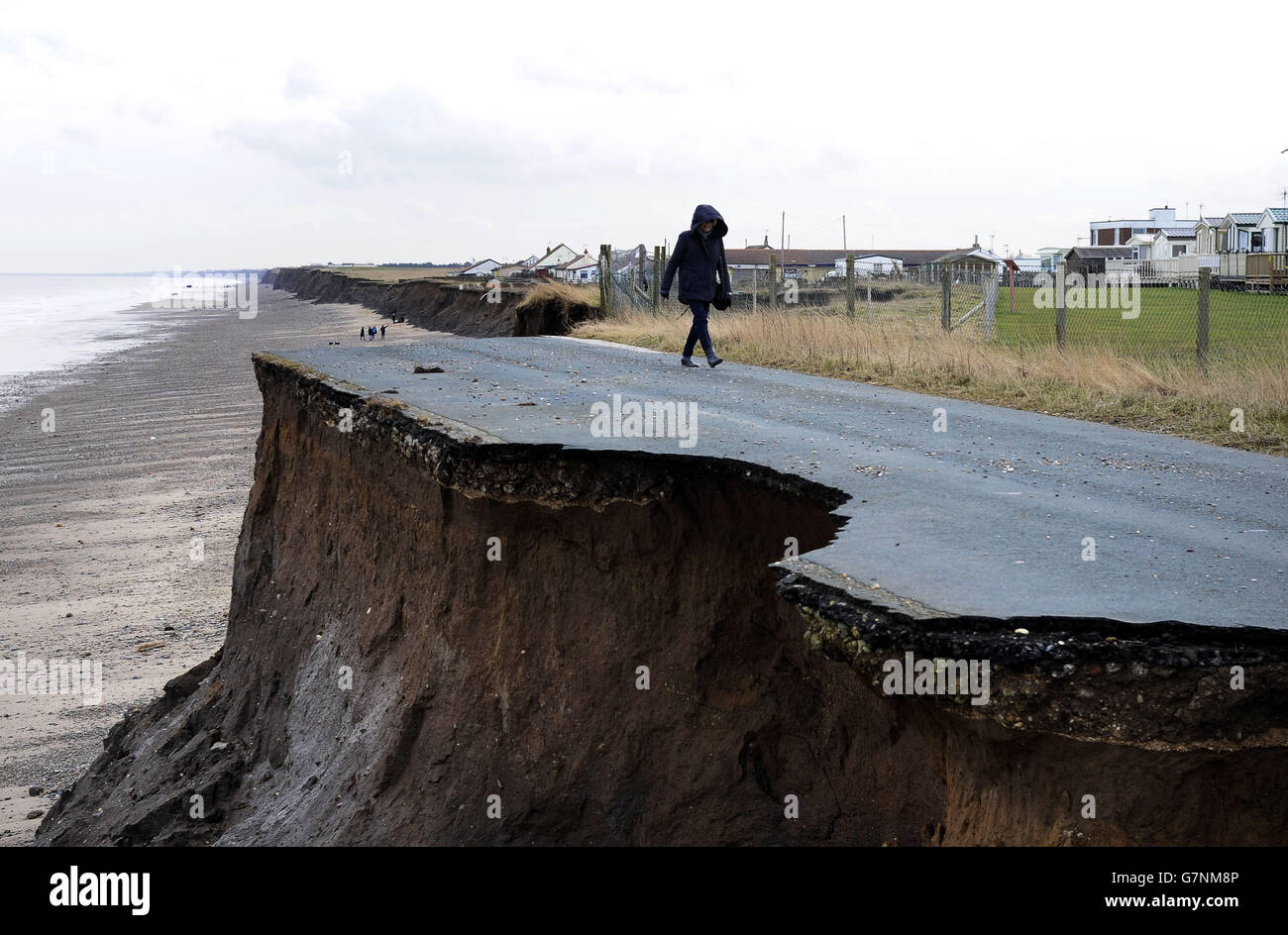 The coastal road south of Bridlington, between Ulrome and Skipsea, shows the rapid pace of erosion with only a small section of the original road left on the cliff tops. Stock Photo