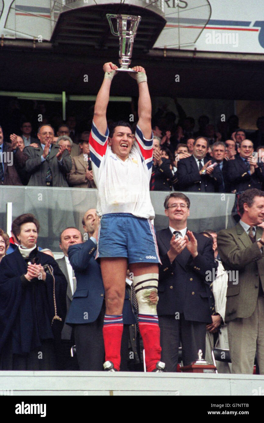 France's captain Abdelatif Benazzi holds aloft the Five nations trophy. Stock Photo