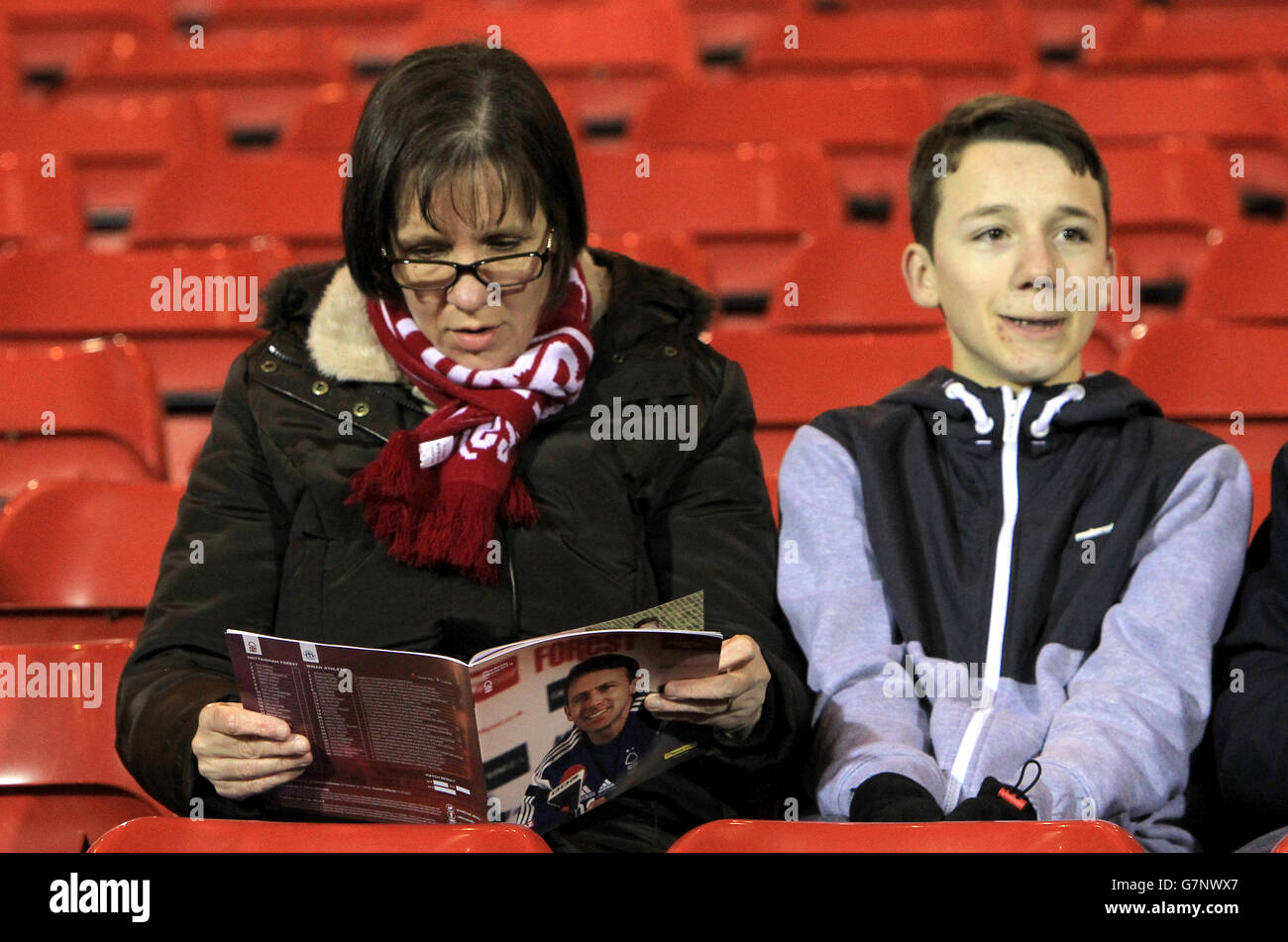 Soccer - Sky Bet Championship - Nottingham Forest v Wigan Athletic - The City Ground. A fan reads a copy of the program prior to kick off Stock Photo