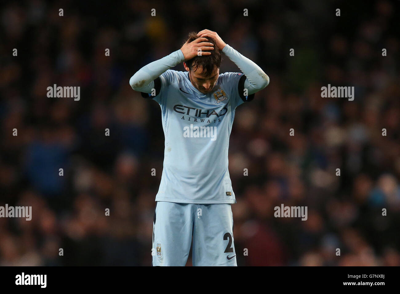 Soccer - UEFA Champions League - Round of 16 - First Leg - Manchester City v Barcelona - Etihad Stadium. Manchester City's David Silva stands dejected Stock Photo