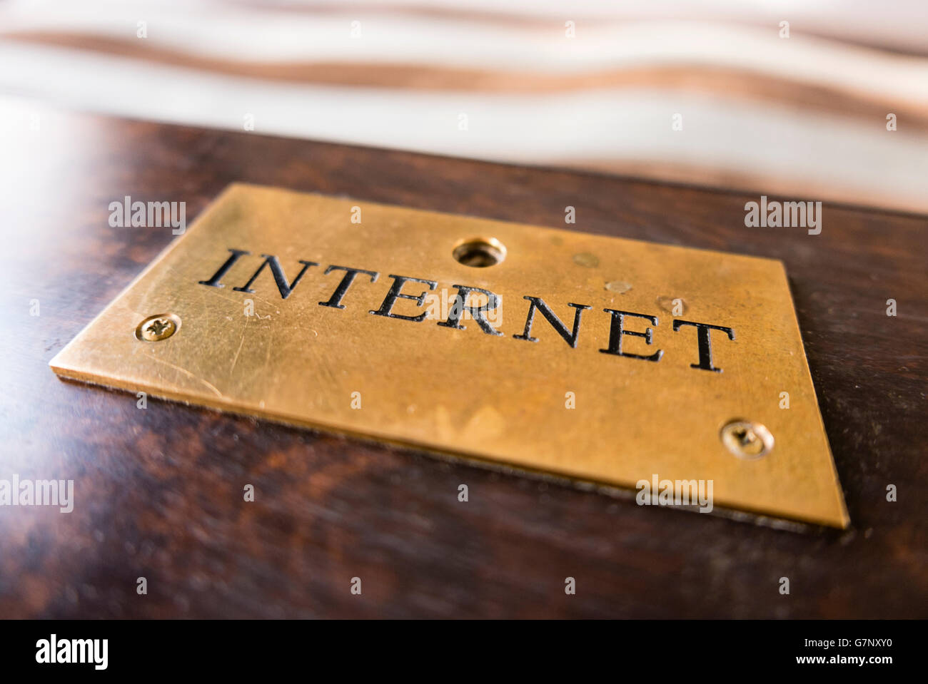 A brass plaque sign saying 'Internet' Stock Photo