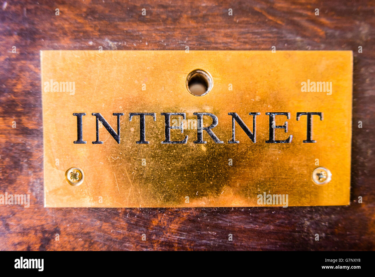 A brass plaque sign saying 'Internet' Stock Photo